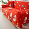 An orange festive sofa cover featuring Christmas and winter holiday patterns on a sofa.