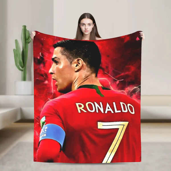 A football player wearing a red jersey with the name RONALDO and number 7 is featured on a throw blanket.