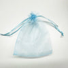 A sheer light blue organza gift bag tied with a thin blue ribbon, used for bulk storage.