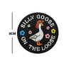 Black embroidery patch featuring a goose with a hat and surrounding floral elements, with text reading Silly Goose on the loo
