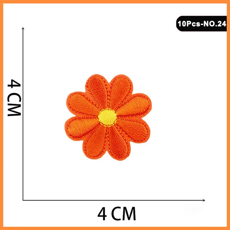 A single orange embroidered flower patch with a yellow center, measuring 4 cm across.