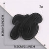 A set of five black embroidered leather patches with self-adhesive backing shown against a white background.