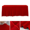 A vibrant red stretchable waterproof rectangle tablecloth draped over a table.