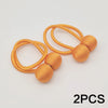Two gold-colored magnetic ball curtain tiebacks with thin cord loops.