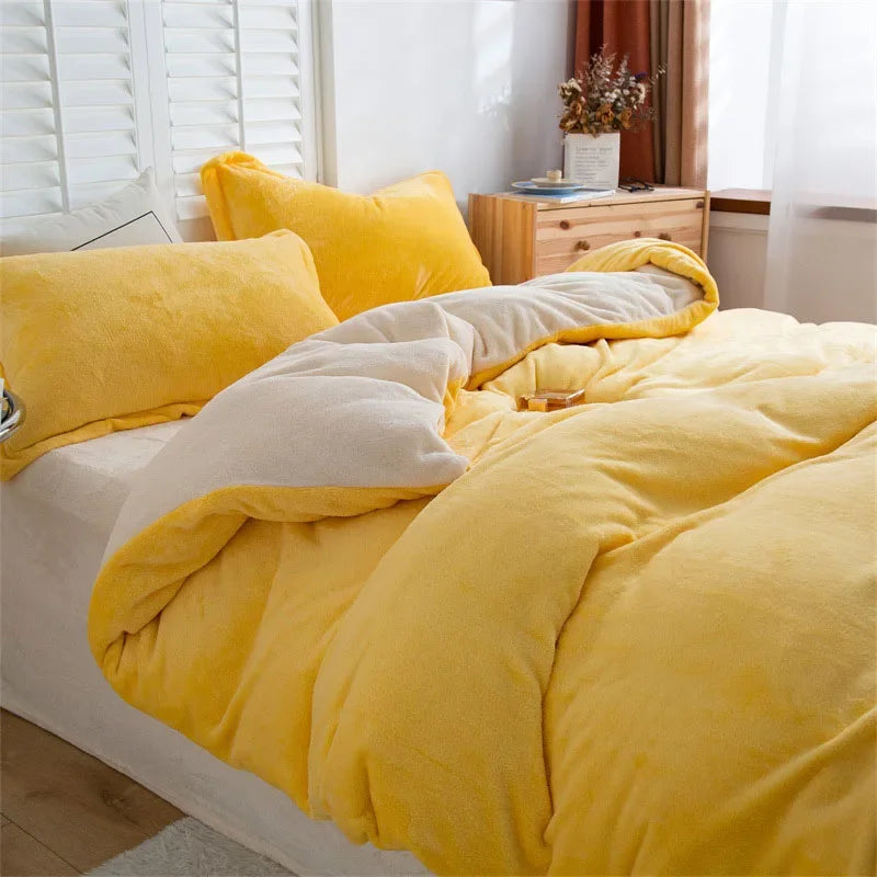 A bright yellow luxurious flannel duvet cover set displayed on a bed with white blinds and wooden furniture.