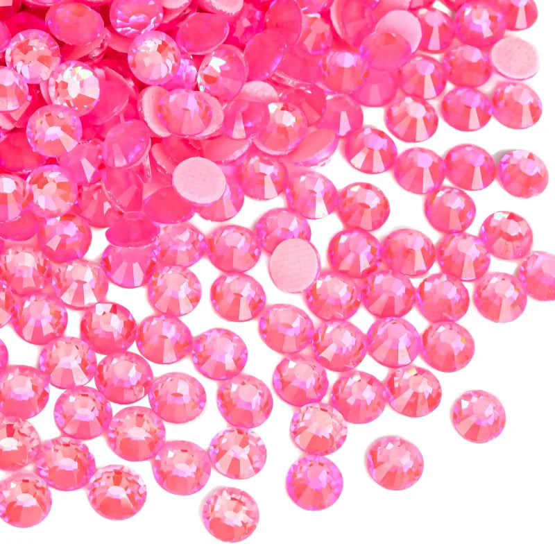 A pile of pink and magenta flatback glass rhinestones.