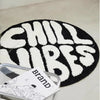 Black and white round letter pattern floor mat with the word CHILLUBES