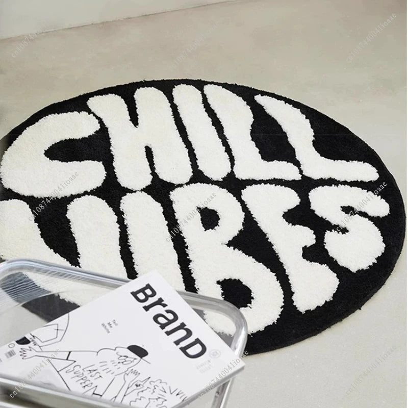 Black and white round letter pattern floor mat with the word CHILLUBES