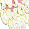 Die-cut white and gold glitter cheer letter iron-on patches on a pink background