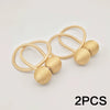 Two gold-colored minimalist magnetic ball curtain tiebacks on a white background.