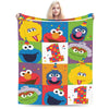 A colorful flannel throw blanket featuring characters like Elmo and Friends from Sesame Street