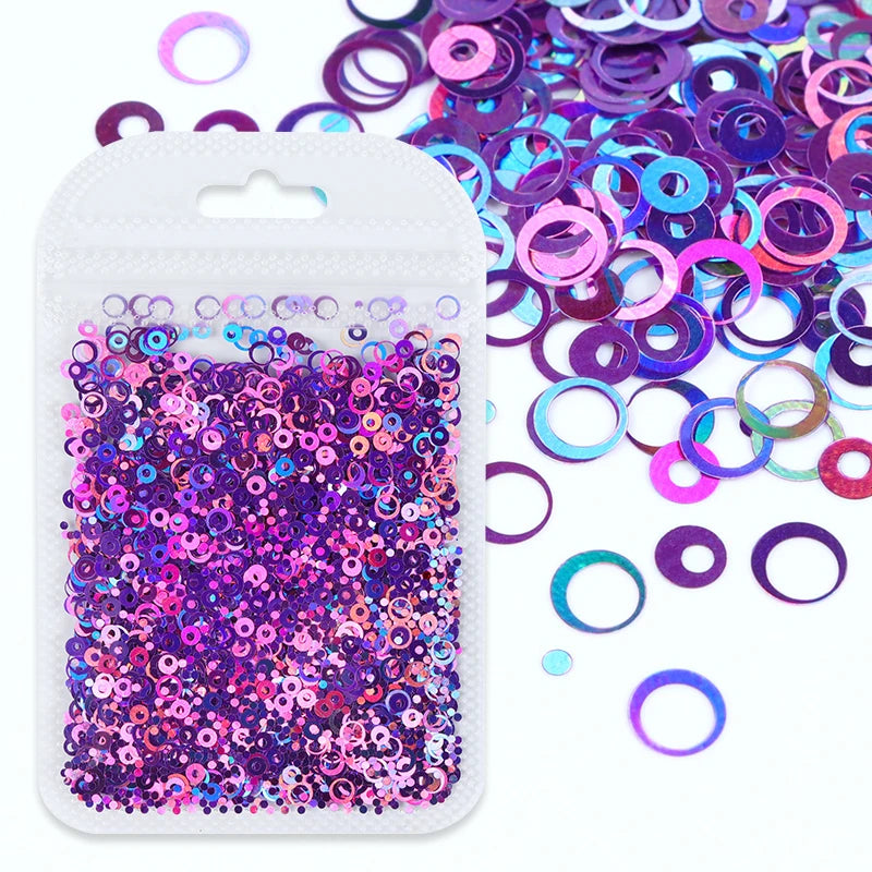 A clear plastic pouch filled with purple and pink glitter resin filler for epoxy art