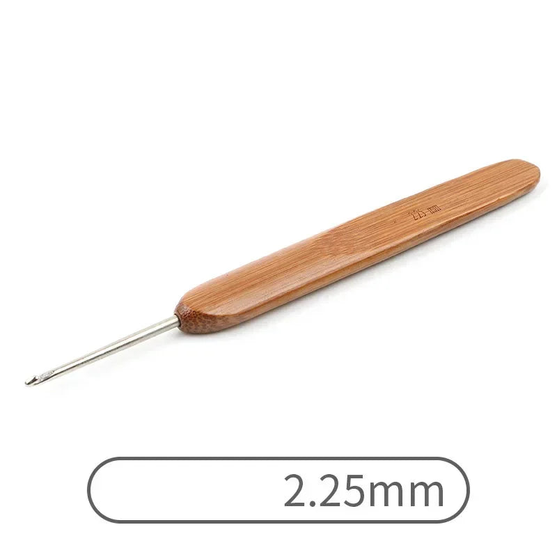 A wooden crochet knitting needle with a 2.25mm tip.