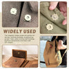Close-up of magnetic snaps used for sewing and crafting on fabric, alongside a leather bag.