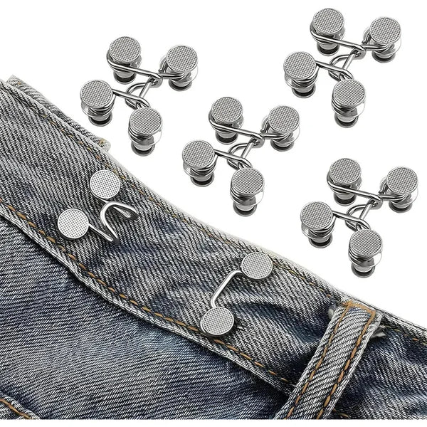 Adjustable button pins for jeans showing various silver and gold-toned pins on denim fabric