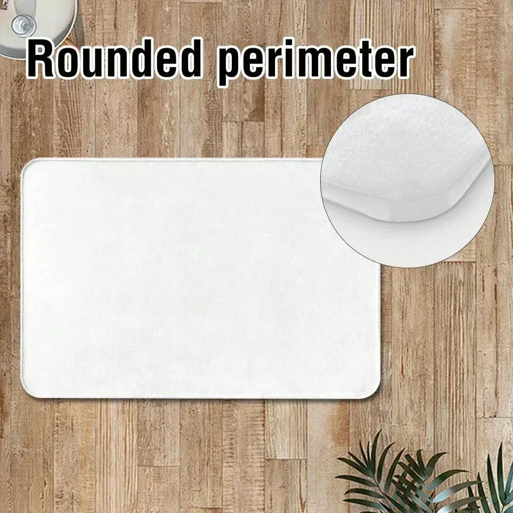 A white, rounded perimeter doormat placed on a wooden floor.