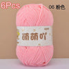 A skein of pink chenille yarn is shown against a neutral background.