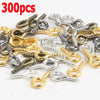 A pile of various silver and gold eye screw pins for jewelry making.