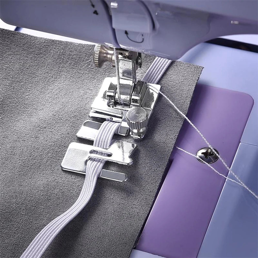 A silver stretch fabric presser foot is shown attached to a gray fabric, used for domestic sewing machines.