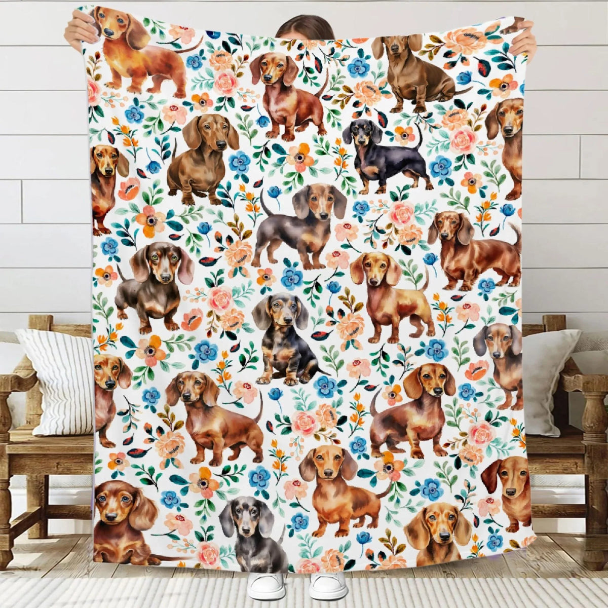 A colorful flannel blanket featuring various adorable dachshund dogs in a floral pattern.