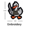 Black and white embroidery patch of a duck with a weapon and orange feet