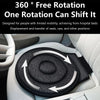 A black rotating car seat cushion is shown placed in a light-colored car seat.