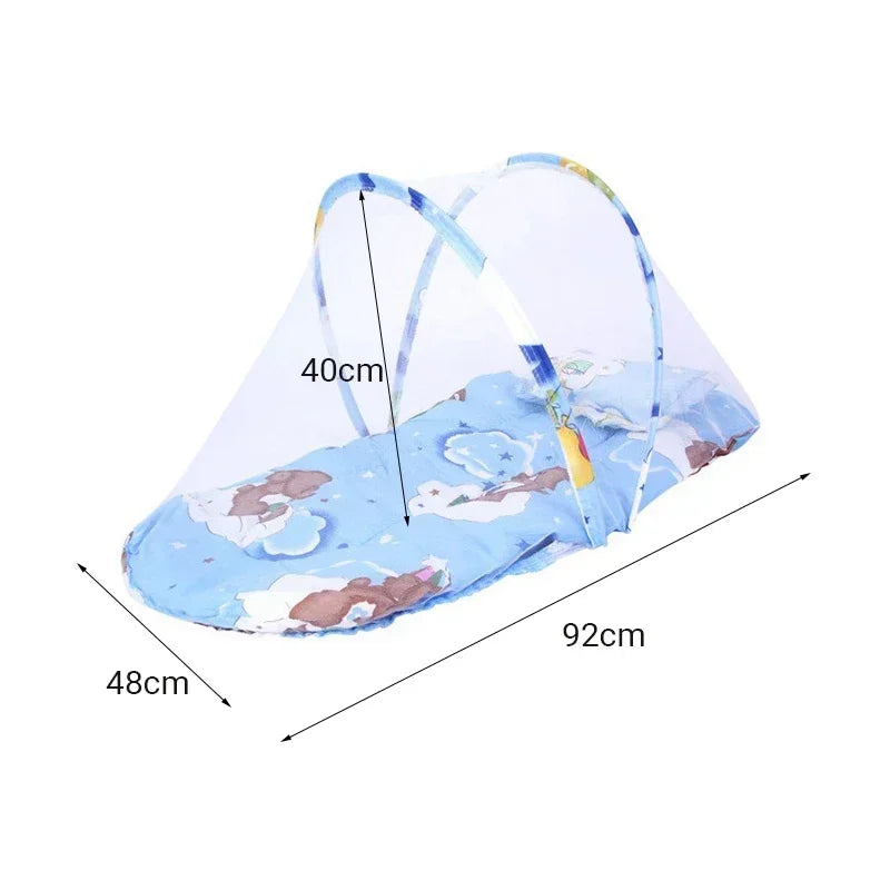 A portable baby crib net with soft padding, shown spread out on a surface.