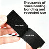 A hand holds a piece of black hook and loop tape, showing the fuzzy side and the hook side.