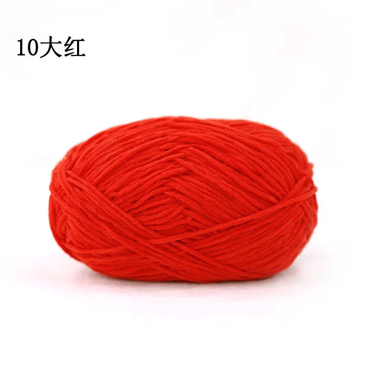 A ball of bright red 3mm matte chenille yarn for knitting and crochet.