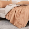 A luxurious beige bamboo duvet cover set draped over a bed with soft pillows.