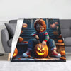 A flannel throw blanket featuring Chucky from the horror movie surrounded by carved pumpkins.