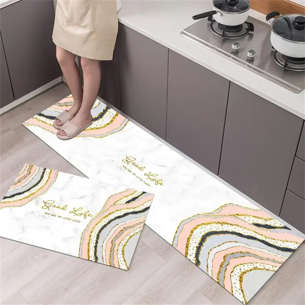 A rectangular kitchen rug with a diamond print featuring soft pastel stripes on a light wood floor.