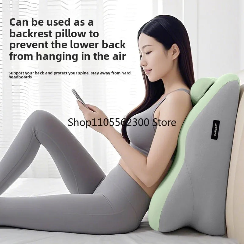 A woman is lying down using an ergonomic pillow designed to support the lower back and prevent hanging in the air.