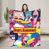 A colorful throw blanket featuring characters from Bob's Burgers in a cartoon style.