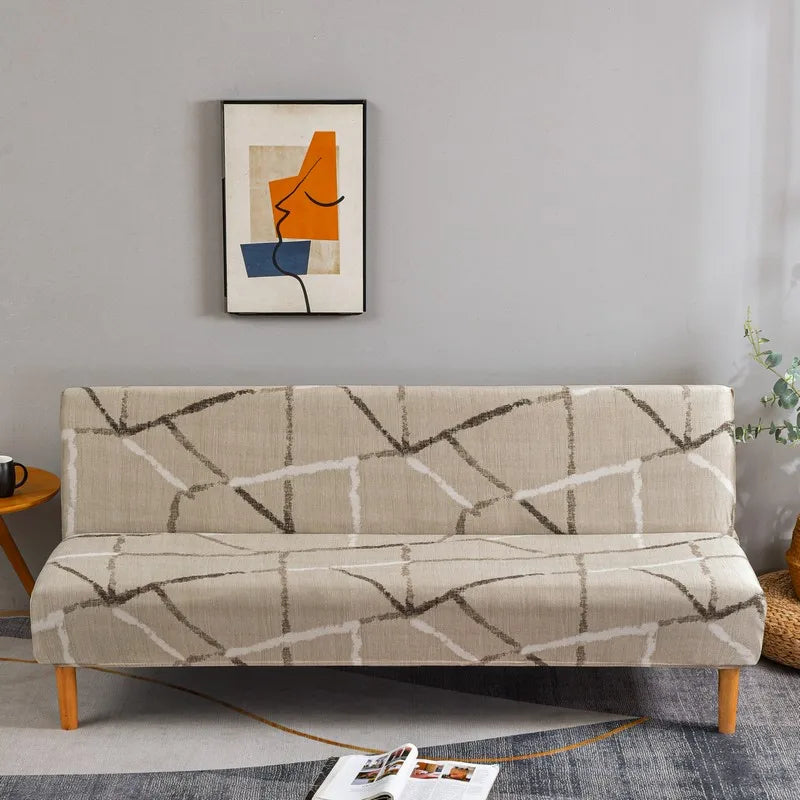 A beige sofa with geometric print spandex slipcovers featuring gray and white lines, placed in a modern room.