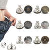 A collection of gold and silver adjustable button pins for clothing, including various sizes and finishes.
