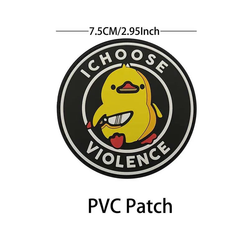 A black circular PVC patch featuring a yellow chick with an open mouth, surrounded by text that reads ICHOOSE VIOLENCE and di
