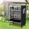 A black waterproof bird cage with a wire mesh roof and side panels is placed outdoors on grass.