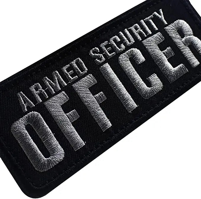 Black embroidered security patch with silver text reading Armed Officer
