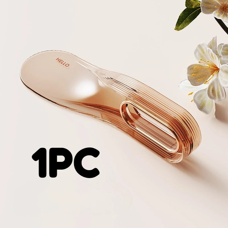 A single piece of rose gold silicone mattress lifter and bed linen organizer resting on a light background.