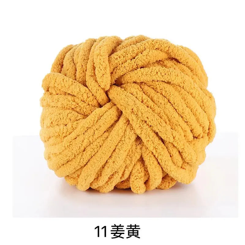 A ball of chunky yellow acrylic yarn used for knitting and crochet projects.