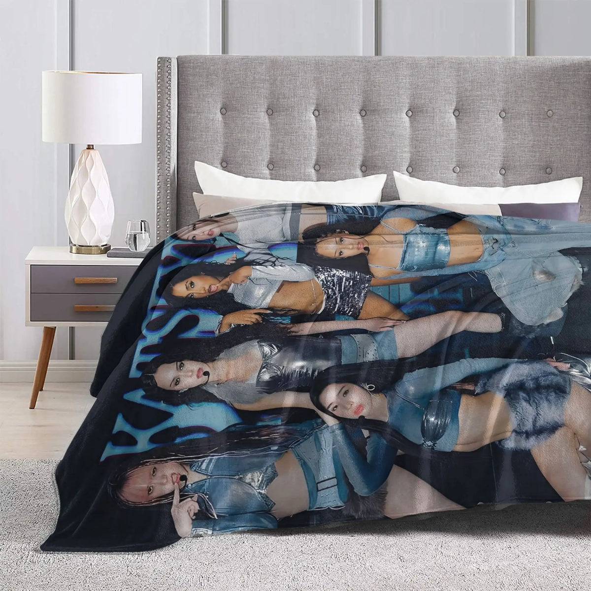 A cozy K-Pop fleece throw blanket featuring multiple women in various poses and outfits.