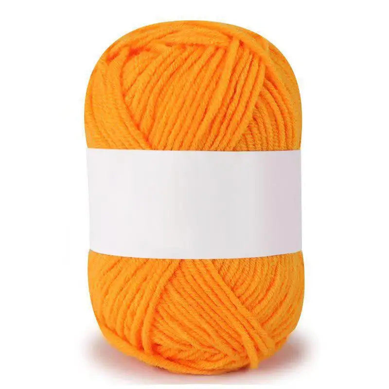A ball of bright orange soft milk cotton knitting yarn.