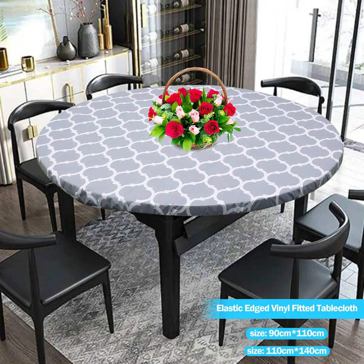 Round gray and white patterned elastic-edged vinyl tablecloth set with black dining chairs