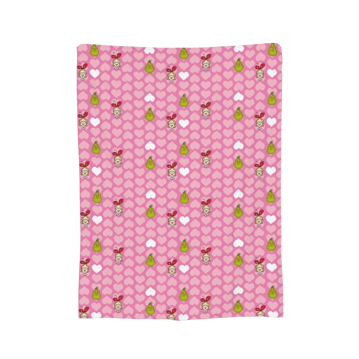 A pink patterned throw blanket featuring small embroidered characters and green accents.