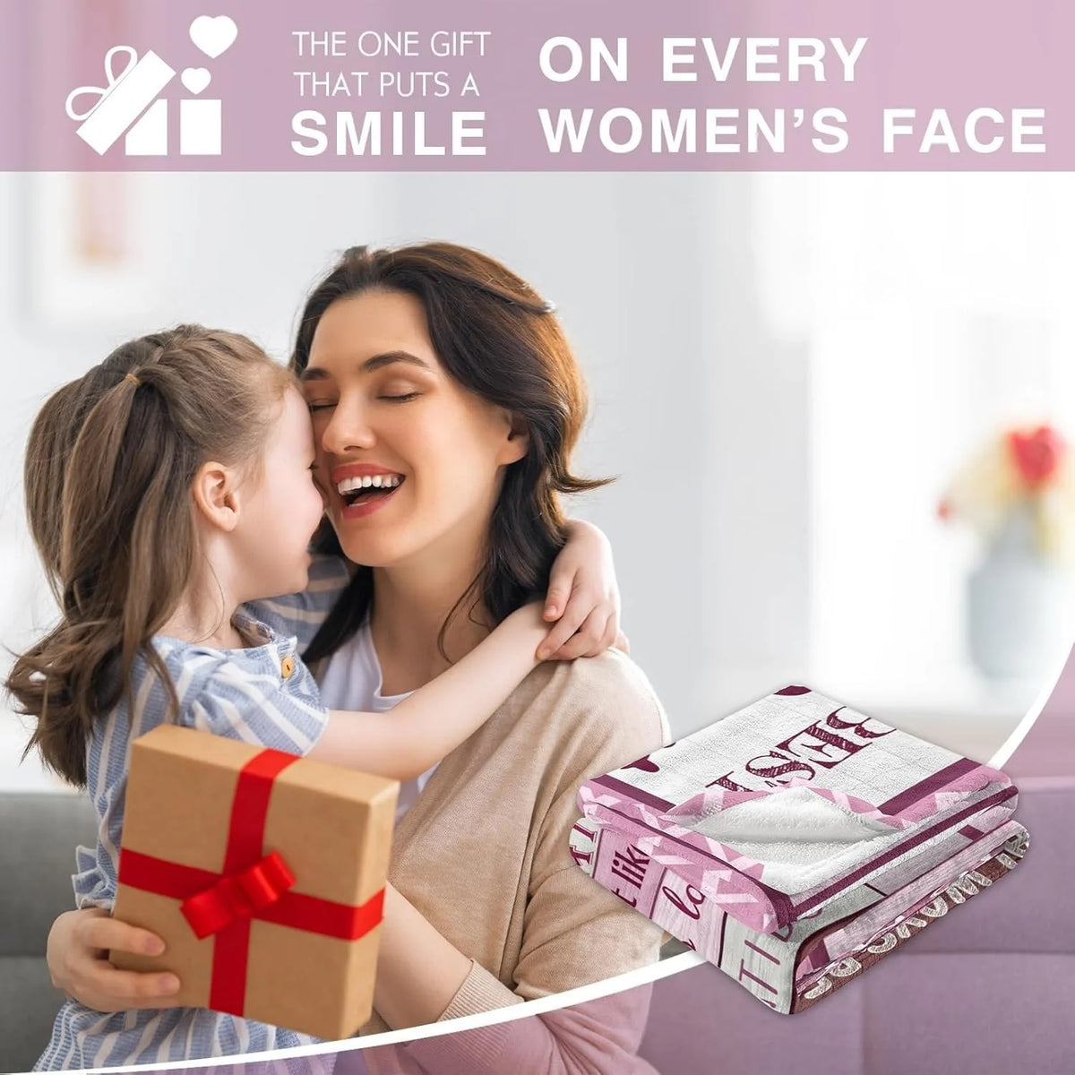A mother embraces her daughter while holding a gift box and a stack of flannel throw blankets.