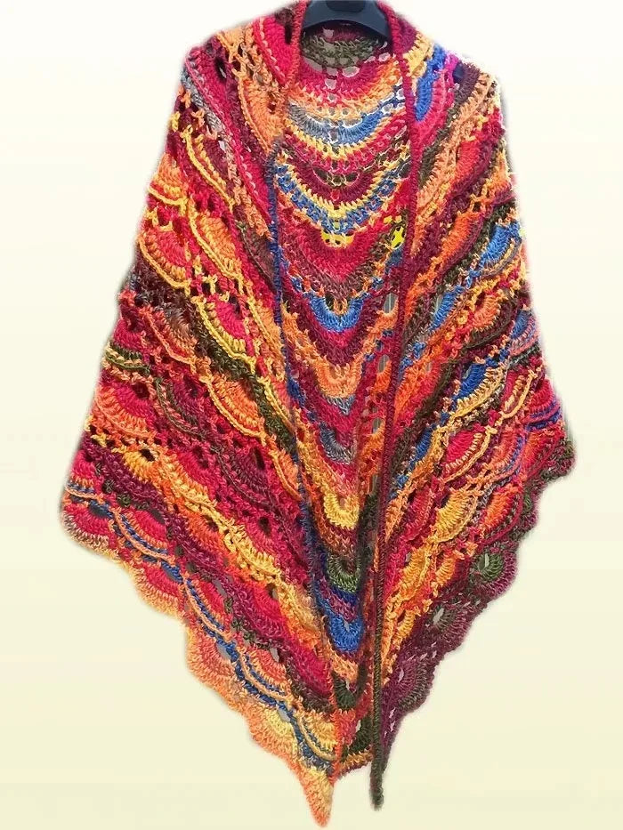 A vibrant gradient dyed wool yarn scarf featuring intricate multicolored chevron patterns.