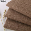 Stack of brown coarse linen and cotton fabric rolls