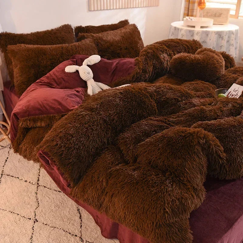A luxurious brown faux fur duvet set with a plum colored cover and a white stuffed animal on a bed.