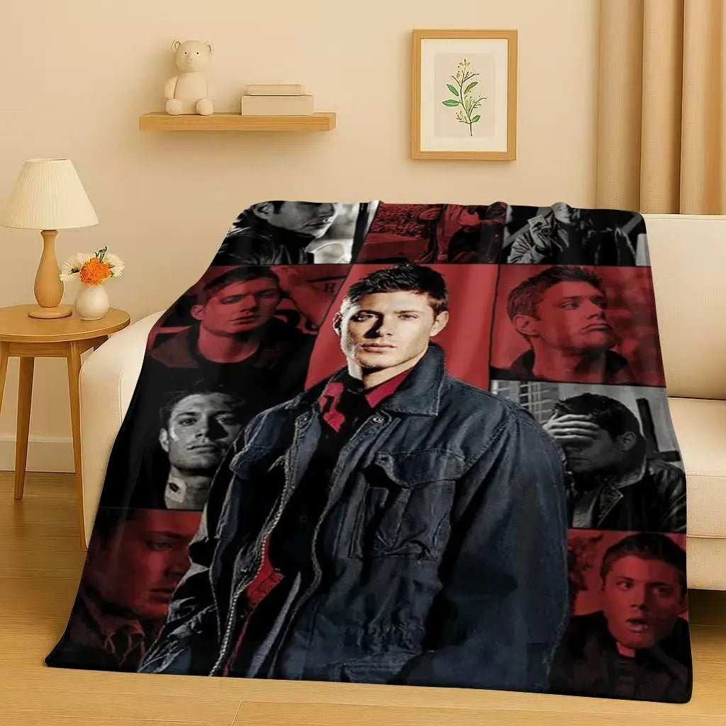 A dark flannel throw blanket featuring a collage of male portraits in various tones and lighting.